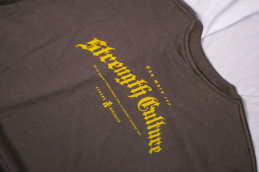 Brown tank top with yellow text on a white background